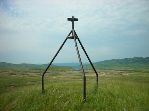 The three-legged cross near the mud volcanoes (we visited) in Romania.